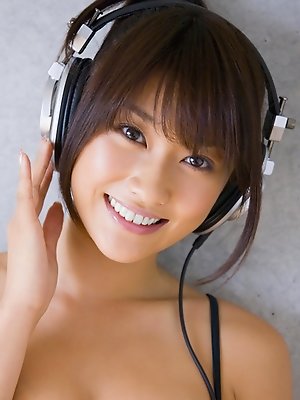 Mikie Hara Asian with big tits and sexy legs listens to the music